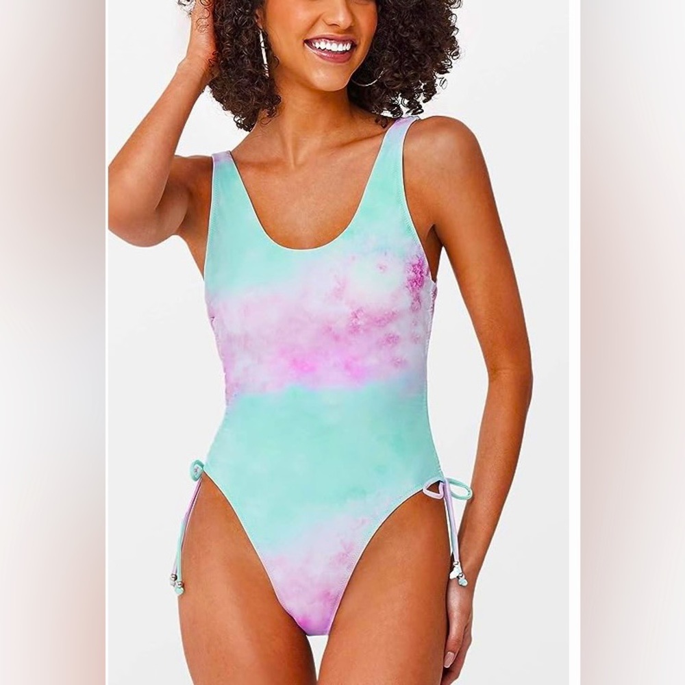 Tie dye one piece swimsuit. Pale blue and pink ruched siding and scoop back. NWT